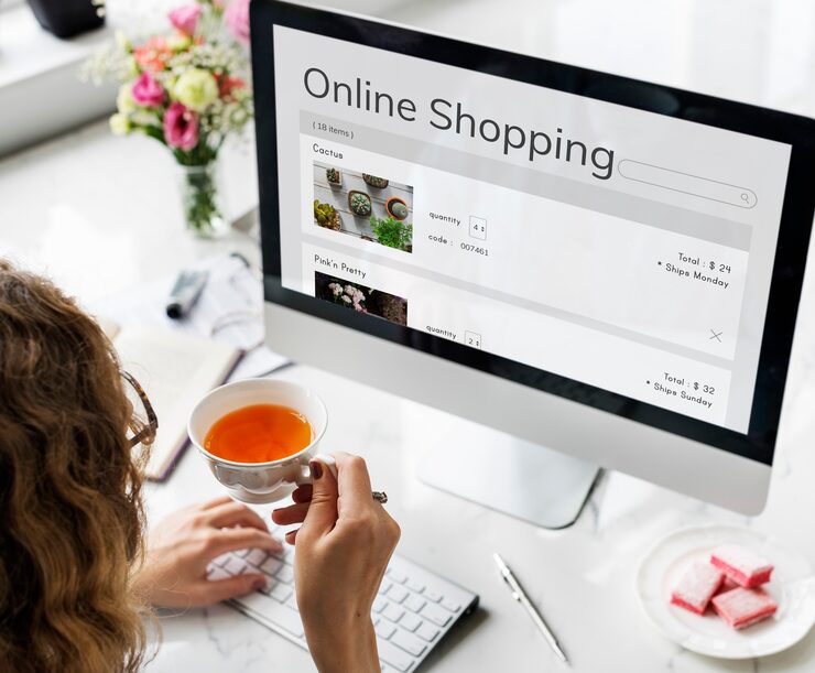 Woman shopping online, computer screen with Online Shopping text and website. Ecommerce Website Development Dubai