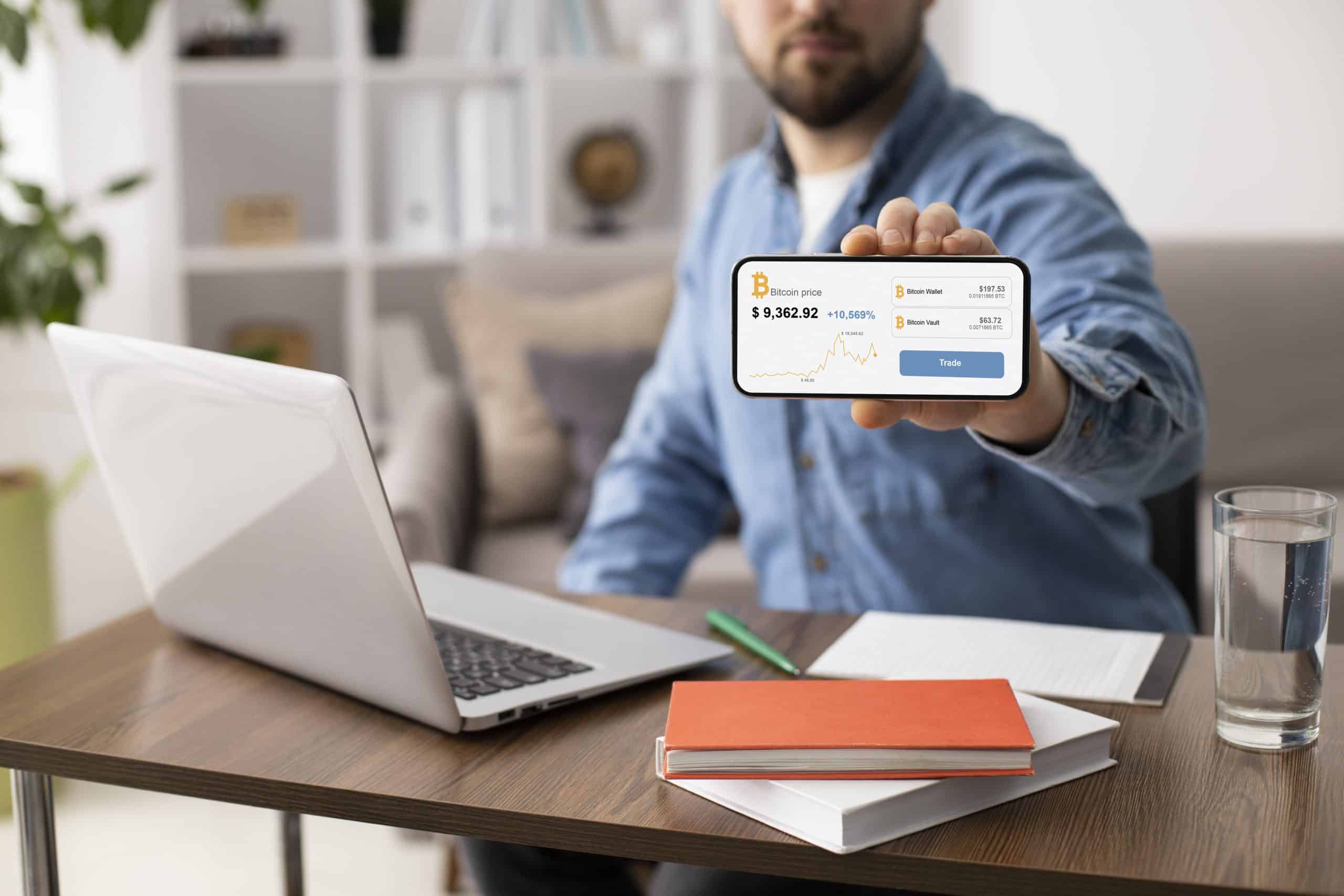 man holding smartphone indoors 1 1 scaled